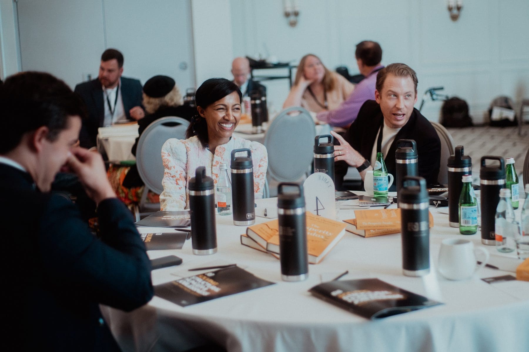 Entrepreneurs around a table at a Faith Driven Entrepreneur conference
