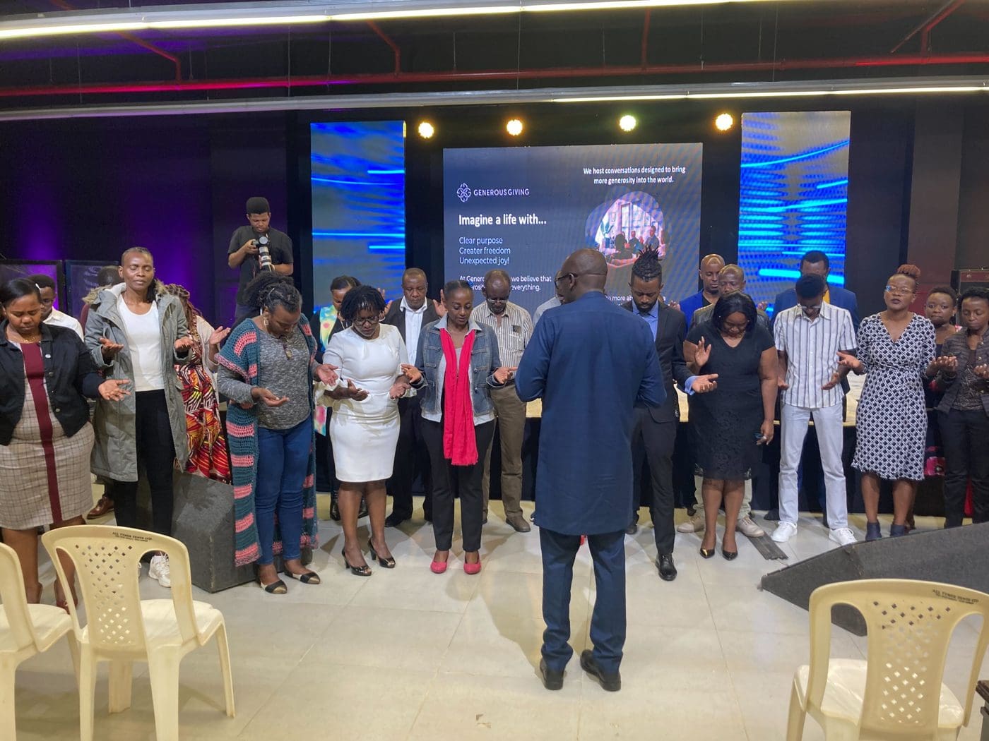 A circle of people gathered at a Generous Giving event
