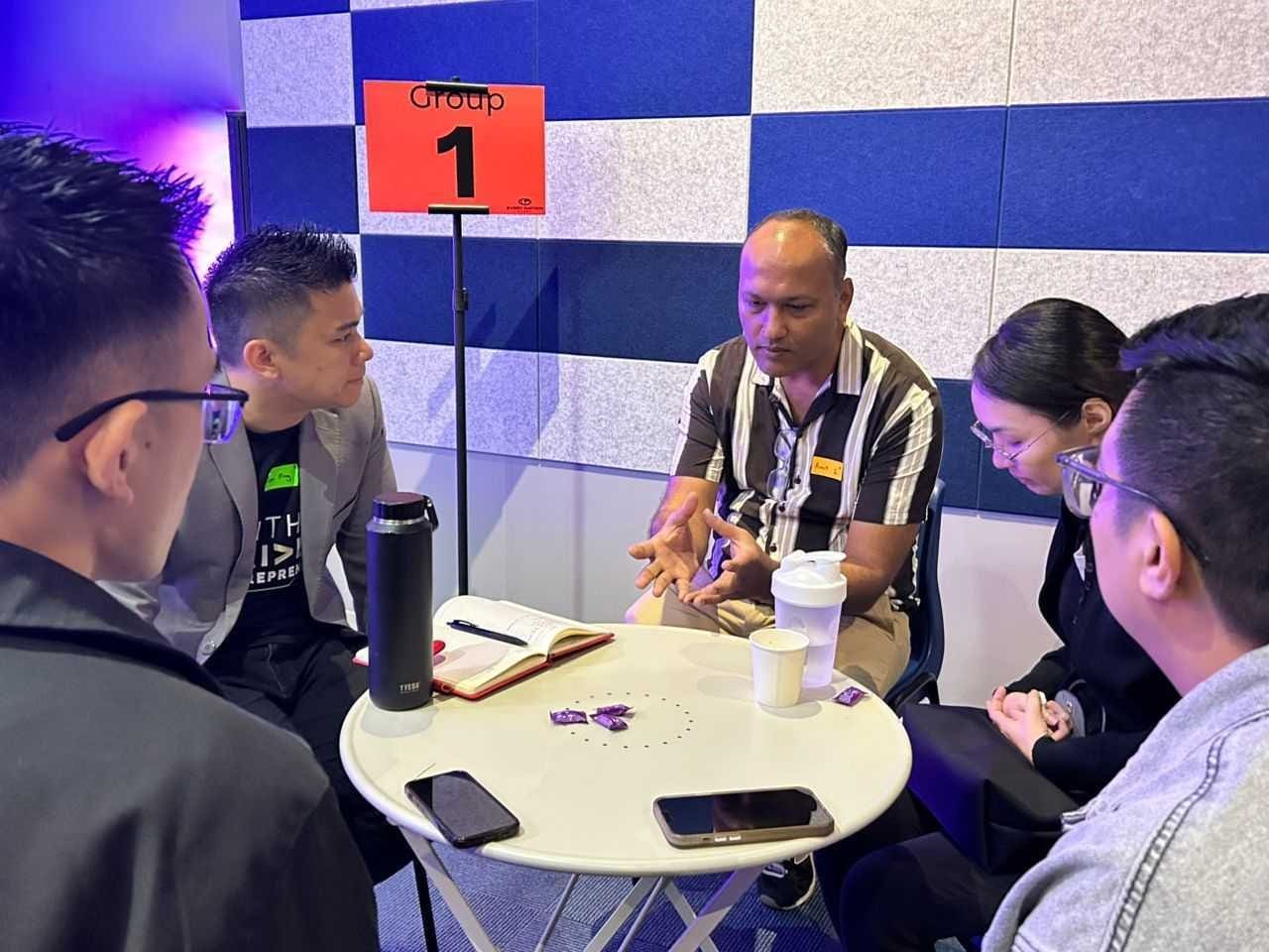A small group of founders around a table